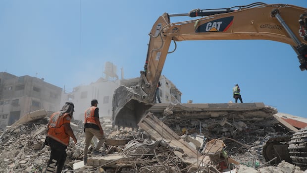 Gaza heavy machinery hydraulic excavators recovery humanitarian infrastructure